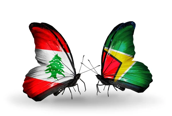 Papillons avec des drapeaux du Liban et de Guyane sur les ailes — Photo