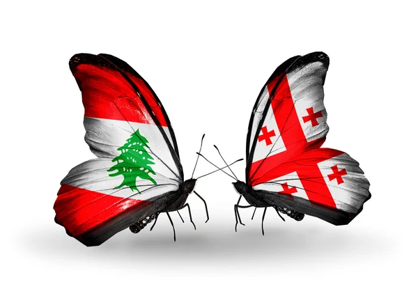 Borboletas com bandeiras do Líbano e da Geórgia em asas — Fotografia de Stock