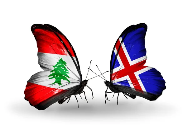 Butterflies with Lebanon and Iceland flags on wings — Stock Photo, Image