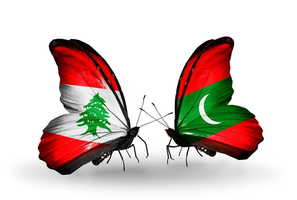 Butterflies with Lebanon and Maldives flags on wings — Stock Photo, Image