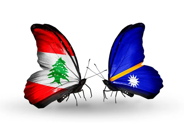 Schmetterlinge mit libanonischen und nauruischen Flaggen auf Flügeln — Stockfoto