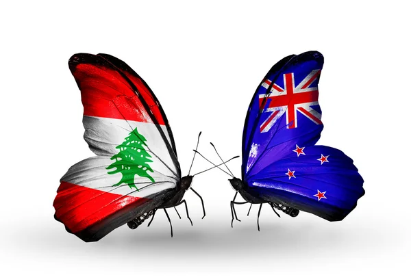 Farfalle con bandiere Libano e Nuova Zelanda sulle ali — Foto Stock