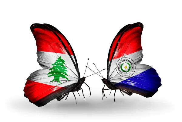 Borboletas com bandeiras do Líbano e Paraguai em asas — Fotografia de Stock