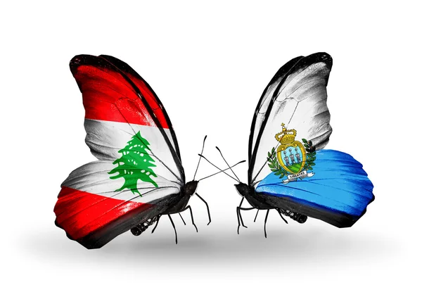 Papillons avec drapeaux Liban et Saint-Marin sur les ailes — Photo