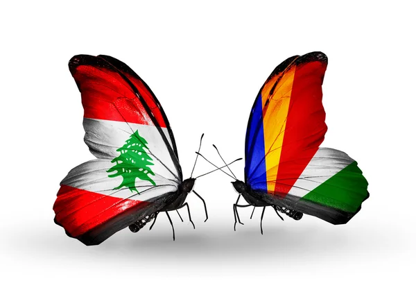 Papillons avec drapeaux du Liban et des Seychelles sur les ailes — Photo