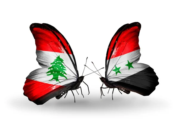 Farfalle con bandiere Libano e Siria sulle ali — Foto Stock