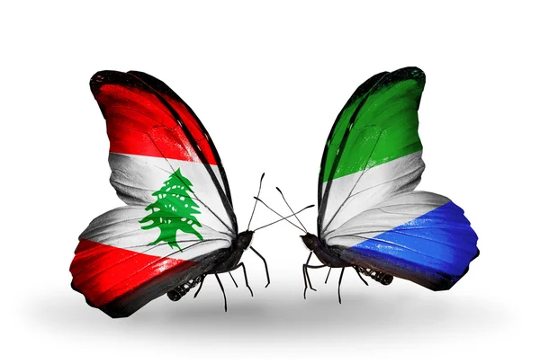 Бабочки с флагами Ливана и Сьерра-Леоне на крыльях — стоковое фото