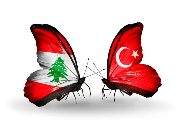 Farfalle con bandiere Libano e Turchia sulle ali — Foto Stock