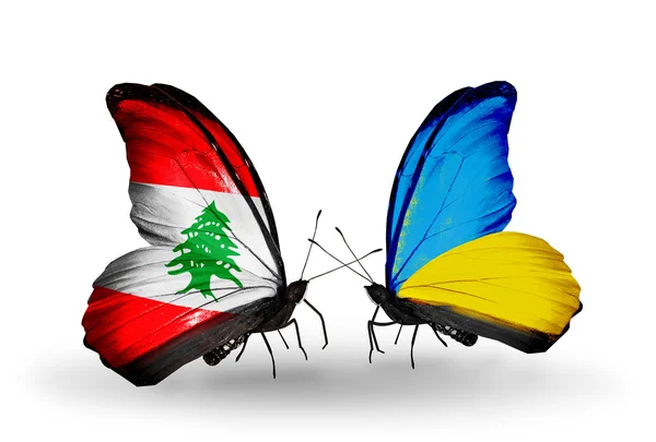 Papillons avec drapeaux Liban et Ukraine sur les ailes — Photo