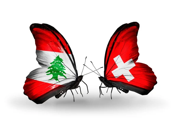 Papillons avec drapeaux Liban et Suisse sur les ailes — Photo