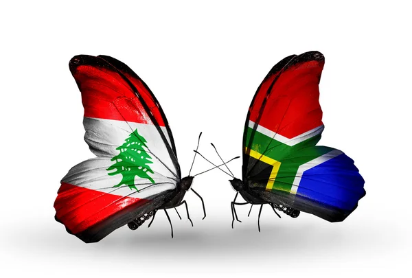 Papillons avec drapeaux Liban et Afrique du Sud sur les ailes — Photo