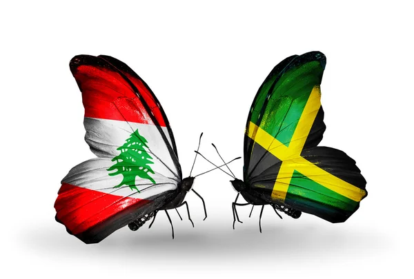 Motýli s Libanonem a Jamajka vlajky na křídlech — Stock fotografie