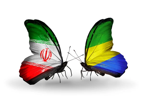 Duas borboletas com bandeiras de relações Irã e Gabão — Fotografia de Stock
