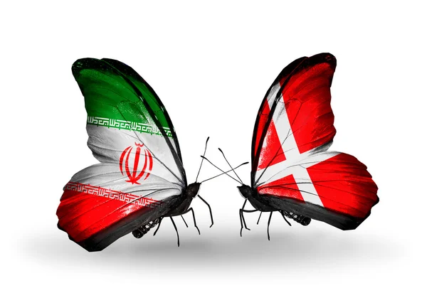 Dwa motyle z flagami stosunki iran i dania — Zdjęcie stockowe