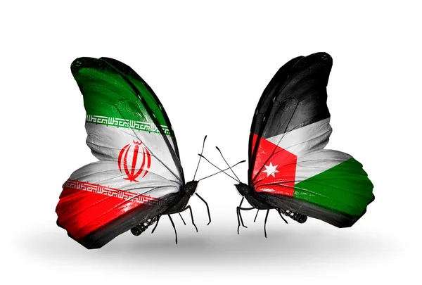 Dva motýli s vlajkami vztahů, Írán a Jordánska — Stock fotografie