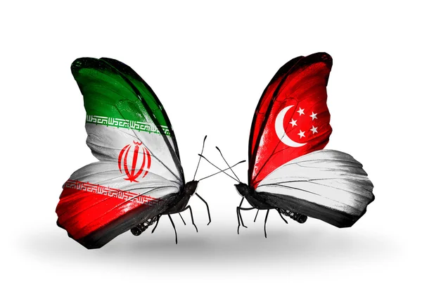 Borboletas com bandeiras do Irã e Singapura — Fotografia de Stock