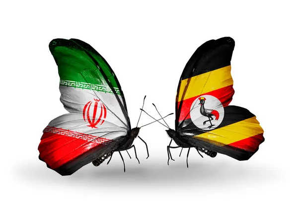 Sommerfugle med flag fra Iran og Uganda - Stock-foto