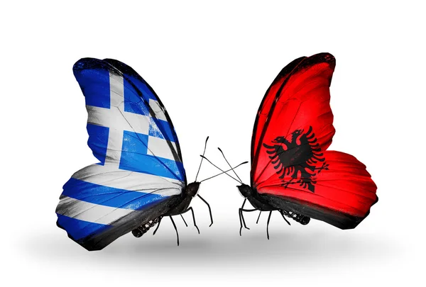 Motýli s vlajkami Albánie a Řecka — Stock fotografie