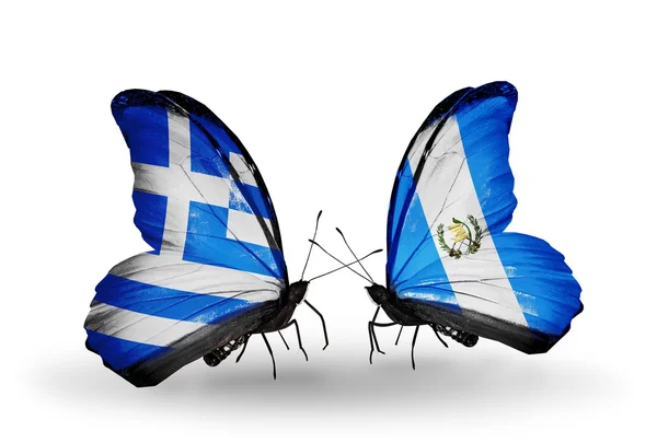 Vlinders met vlaggen van Griekenland en guatemala — Stockfoto