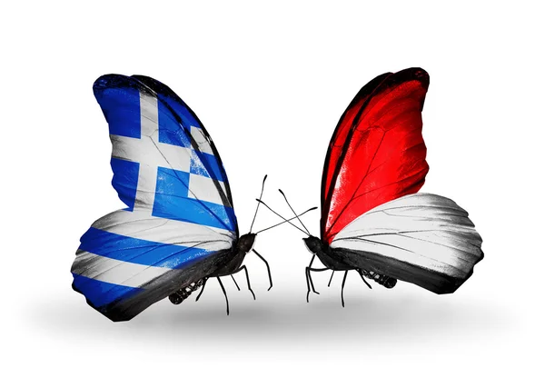 Yunanistan ve monaco, Endonezya bayrakları taşıyan kelebekler — Stok fotoğraf