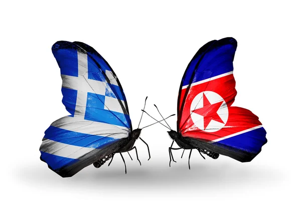 Dos mariposas con banderas de relaciones Grecia y Corea del Norte — Foto de Stock