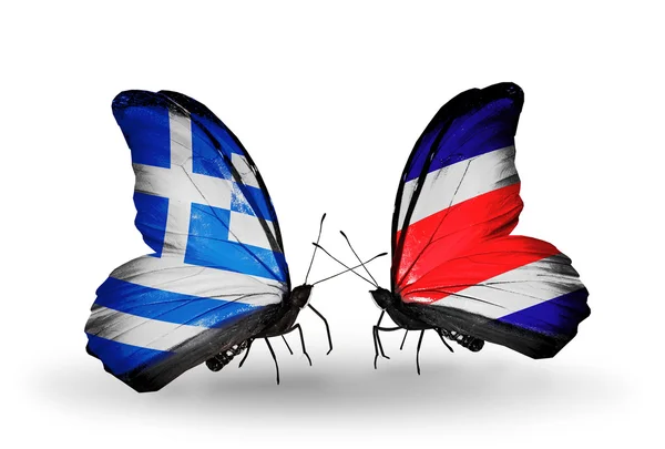 Dva motýli s vlajkami vztahy Řecka a costa rica — Stock fotografie