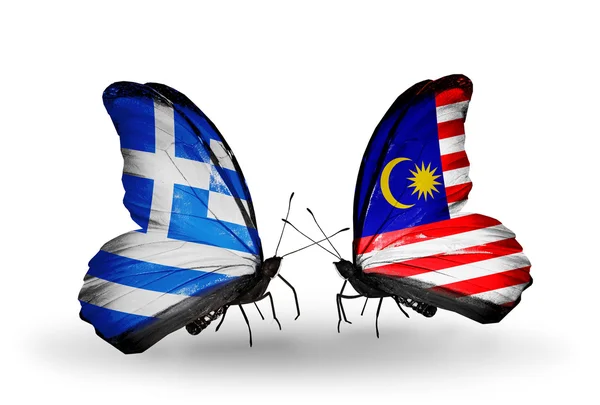 Dva motýli s vlajkami vztahů, Řecko a Malajsie — Stock fotografie
