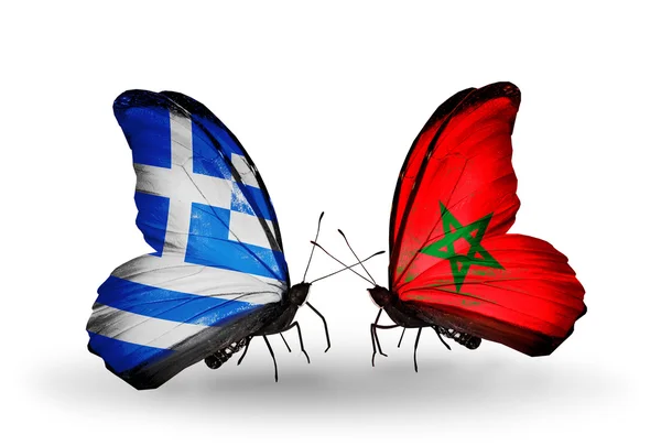Zwei Schmetterlinge mit den Flaggen der Beziehungen Griechenland und Marokko — Stockfoto