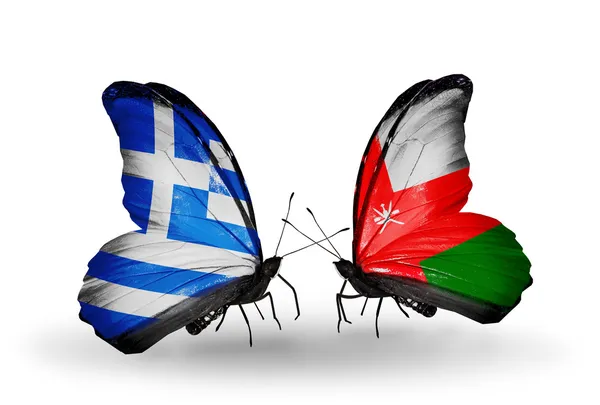 Two butterflies with flags of relations Greece and Oman — Stock Photo, Image