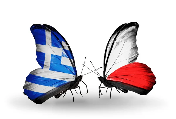 Dos mariposas con banderas de relaciones Grecia y Polonia — Foto de Stock