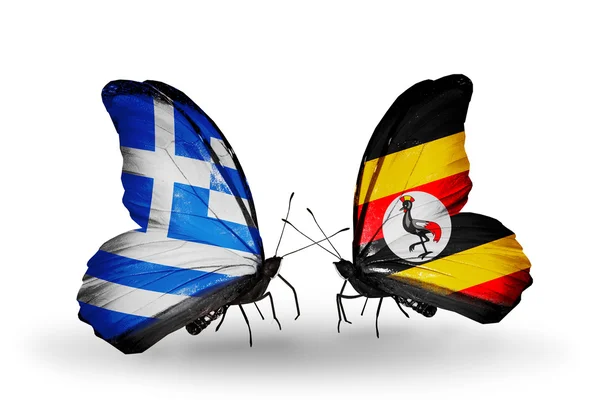 Twee vlinders met vlaggen van betrekkingen Griekenland en Oeganda — Stockfoto