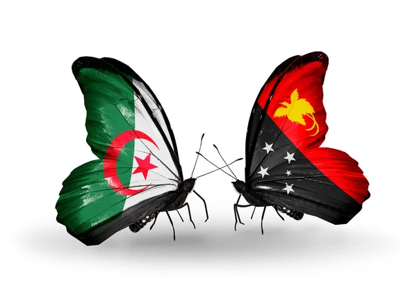 Две бабочки с флагами отношений Алжир и Папуа-Новая Гвинея — стоковое фото