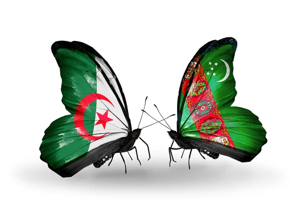 Två fjärilar med flaggor av förbindelserna mellan Algeriet och turkmenistan — Stockfoto