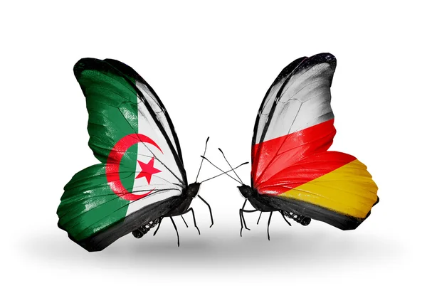 Duas borboletas com bandeiras de relações Argélia e Ossétia do Sul — Fotografia de Stock