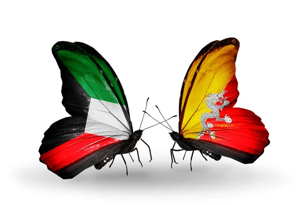 Två fjärilar med flaggor av förbindelserna mellan kuwait och bhutan — Stockfoto
