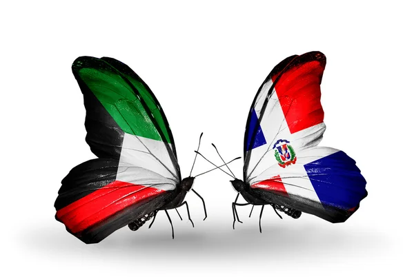 Two butterflies with flags of relations Kuwait and Dominica — Stock Photo, Image