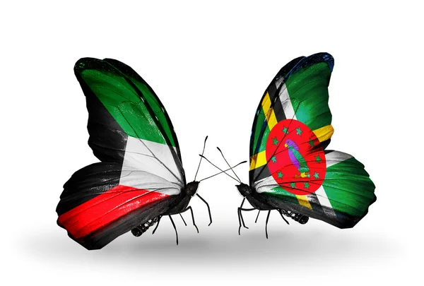 Dva motýli s vlajkami vztahů, Kuvajtu a Dominika — Stock fotografie