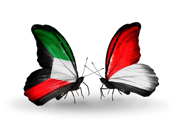 Twee vlinders met vlaggen van de betrekkingen, Koeweit en monaco, Indonesië — Stockfoto