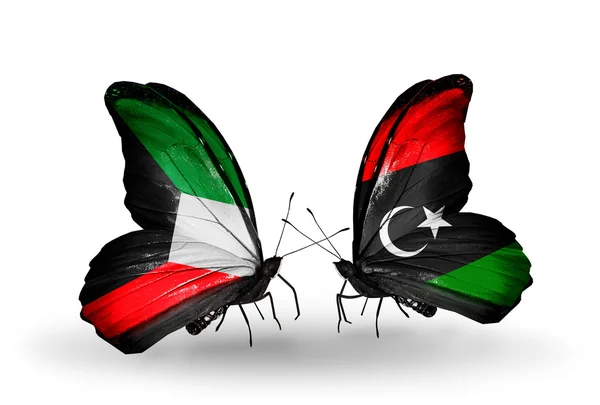 Twee vlinders met vlaggen van de betrekkingen, Koeweit en Libië — Stockfoto