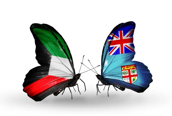 Dva motýli s vlajkami vztahů, Kuvajtu a Fidži — Stock fotografie