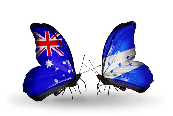 Dva motýli s vlajkami vztahů, Austrálie a Hondurasu — Stock fotografie