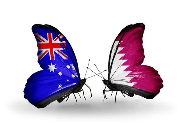 Dwa motyle z flagami stosunków australia i Katar — Zdjęcie stockowe