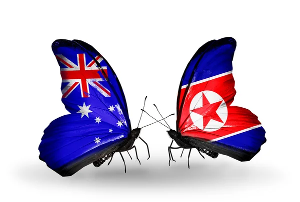 Deux papillons avec des drapeaux de relations Australie et Corée du Nord — Photo