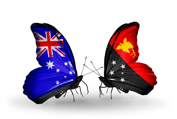 Två fjärilar med flaggor av förbindelserna mellan Australien och papua nya guinea — Stockfoto