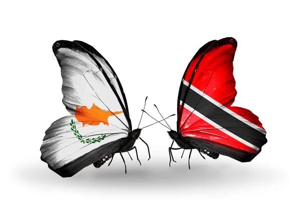 Два метелики з прапорами відносин, Кіпр і Долар Тринідаду і Тобаго — стокове фото