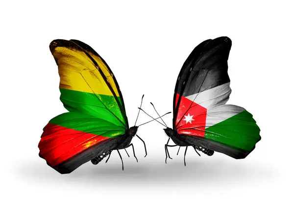 Бабочки с флагами Литвы и Иордании — стоковое фото