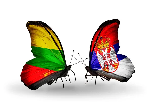 Бабочки с флагами Литвы и Сербии — стоковое фото