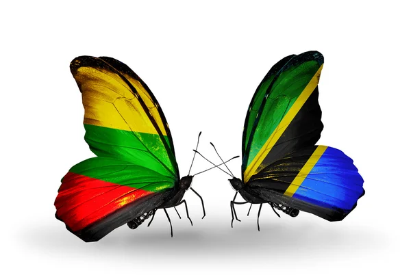 Бабочки с флагами Литвы и Танзании — стоковое фото