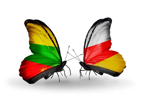 蝴蝶与立陶宛和南奥塞梯的国旗 — 图库照片