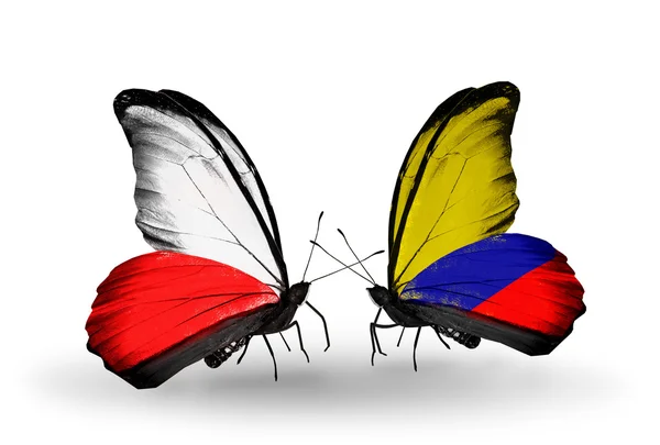 Две бабочки с флагами Польши и Колумбии — стоковое фото